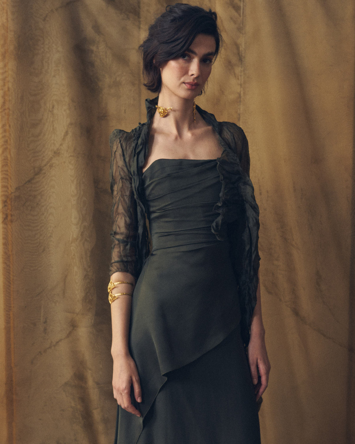 Medium shot front view of Alina strapless sharkskin dress in oxford highlighting pleated bodice and sheer cover-up by T.ba