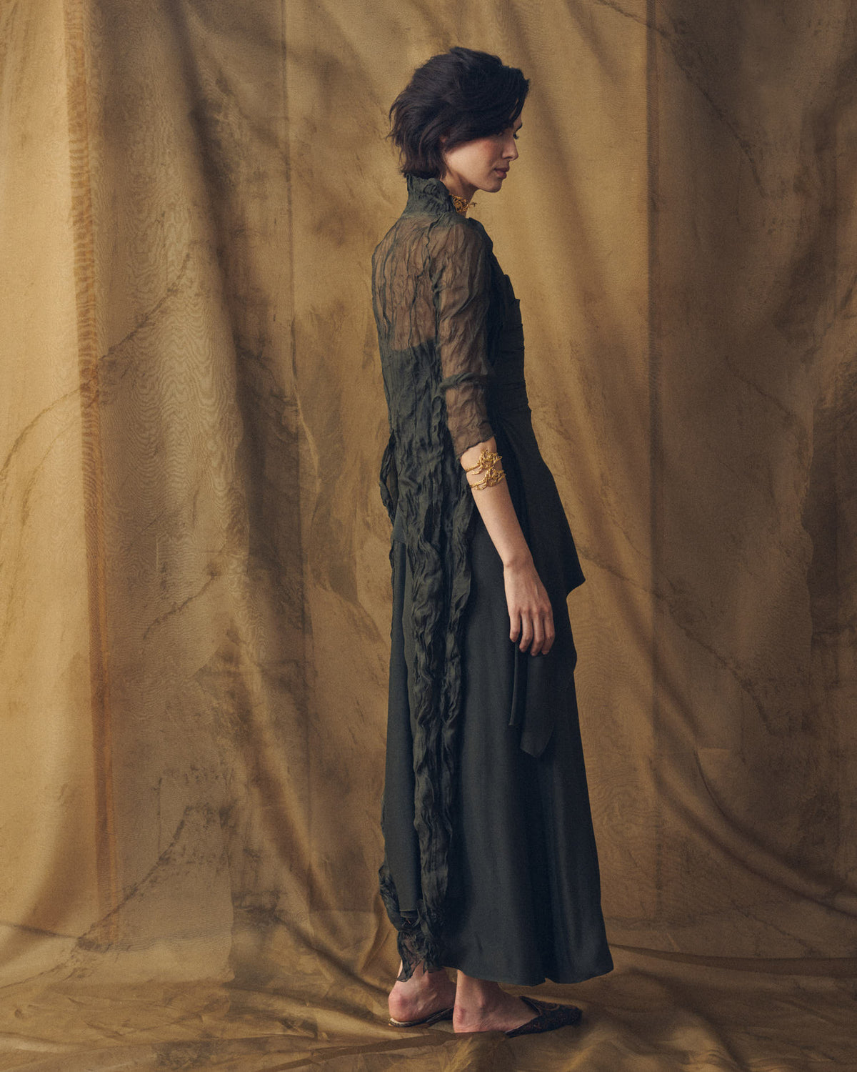Side profile view of Alina long sharkskin dress in oxford paired with textured sheer jacket for women by T.ba