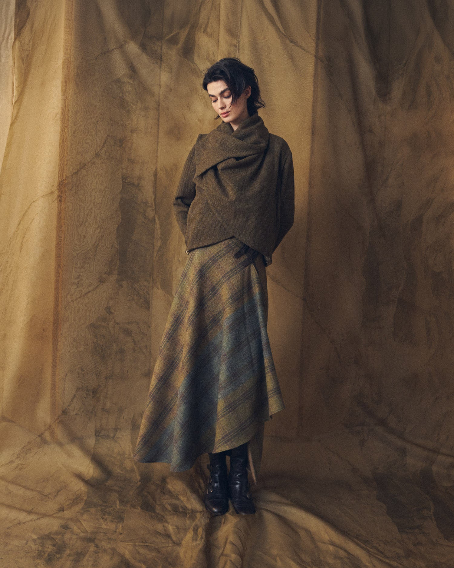 Full body shot of model wearing the Alina Tweed brown wool jacket with a plaid maxi skirt by T.ba