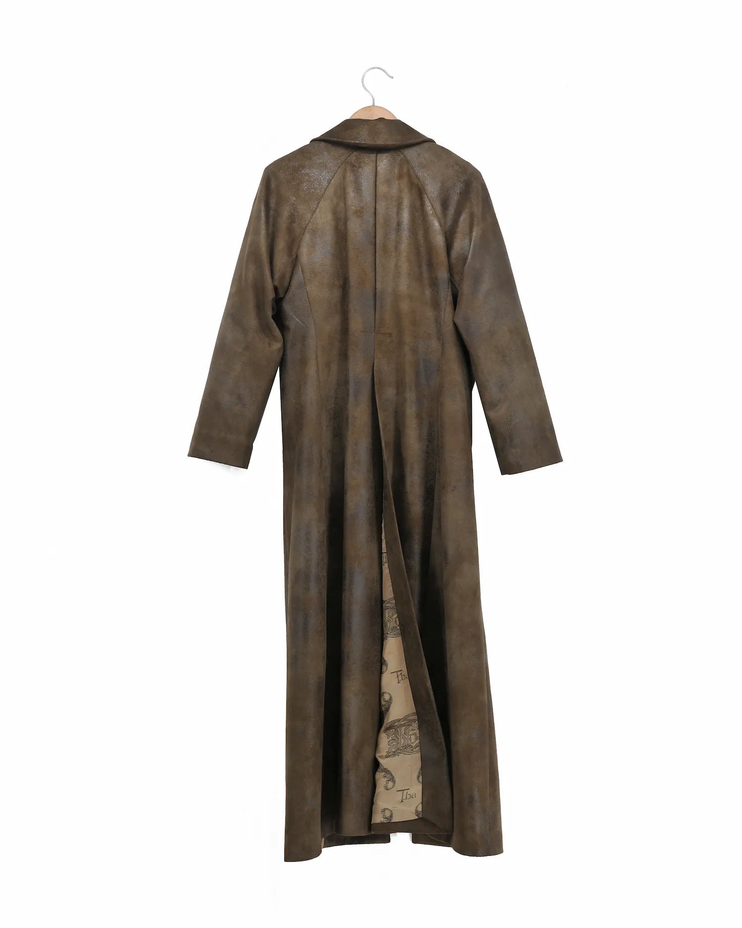 Back view of women's Biella Gnu long coat in distressed khaki fabric featuring a central back vent by T.ba