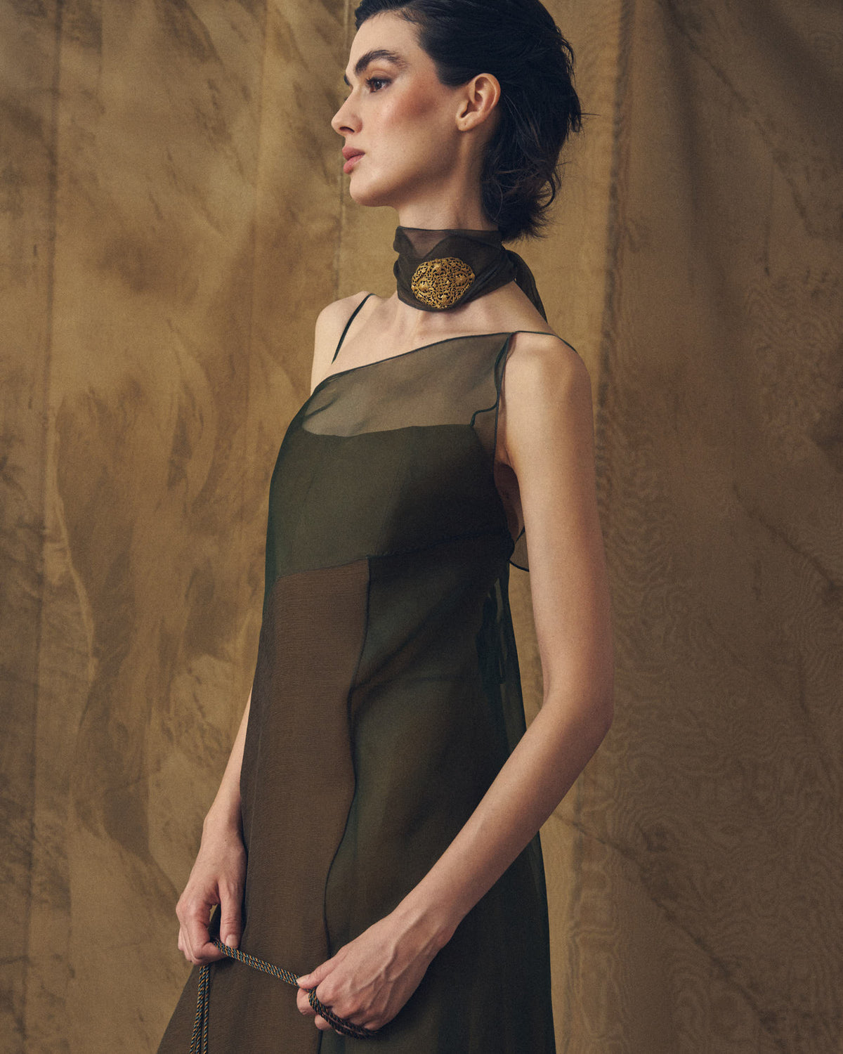 Medium view of the contrasting body and drape of the Biella strap organza dress in hunting green and arbequina by T.ba