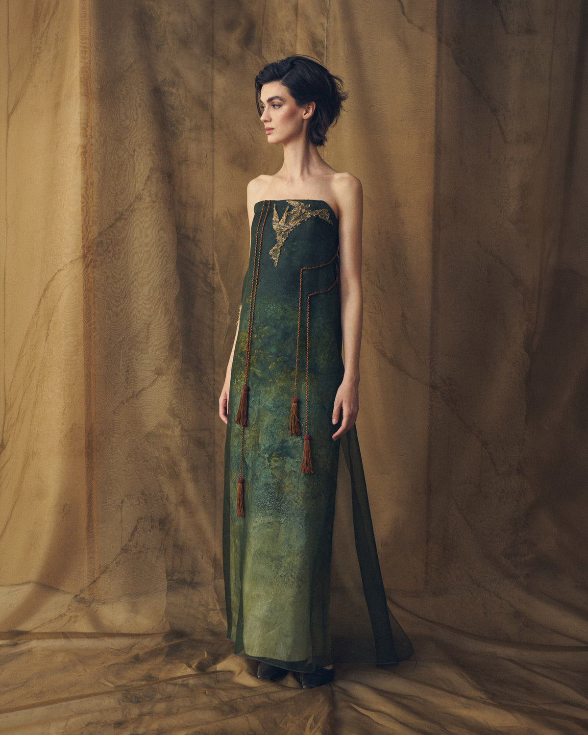 Three-quarter studio view of Birdie strapless maxi organza dress in bayou green for women by T.ba