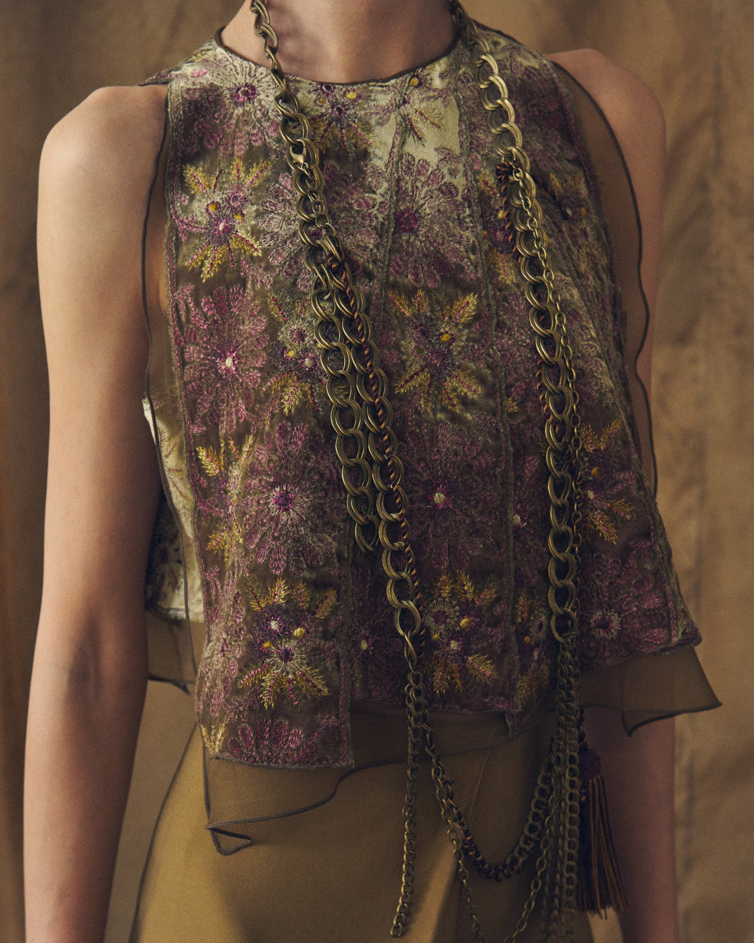 Front close-up view showing the details of the Carlo short top in green velvet with aubergine floral embroidery by T.ba