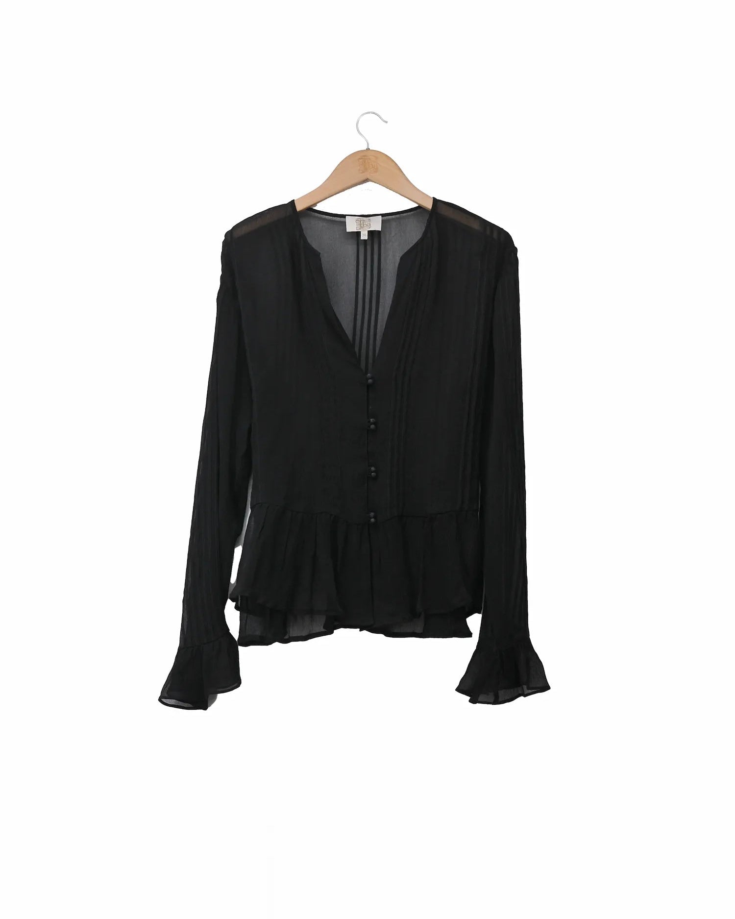 Women's black silk chiffon Lizzie blouse featuring V-neck, pintuck pleats, and ruffled hem and cuffs by T.ba