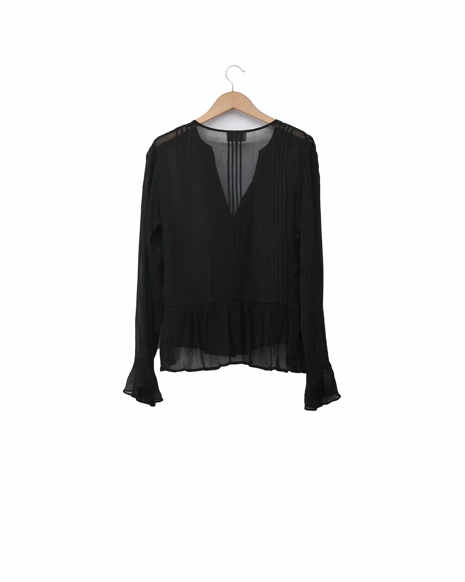 Back side of women's black silk chiffon Lizzie blouse featuring V-neck, pintuck pleats, and ruffled hem and cuffs by T.ba
