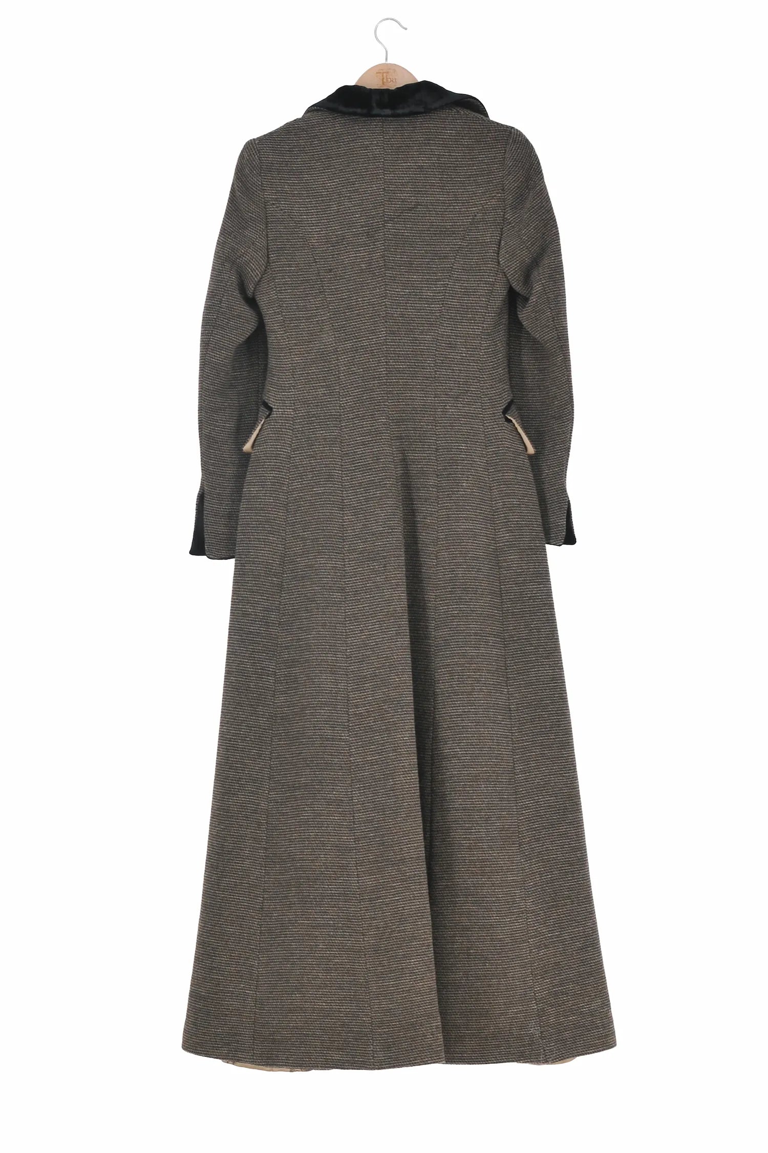Back View of women's Classic Combi long coat in brownish grey tweed wool featuring a black velvet collar and pocket trims by T.ba