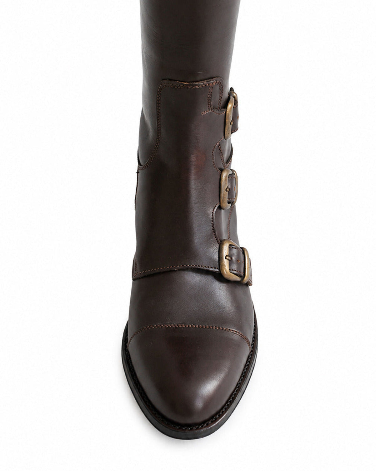 Detailed view of triple brass buckles and stitched toe cap on women's chocolate brown leather riding boot T.ba
