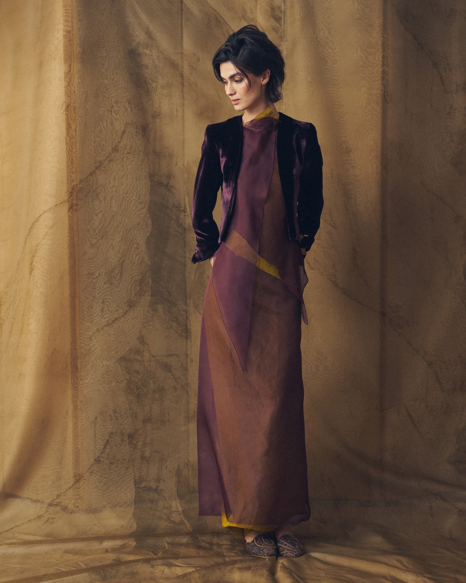 Frontal view of model wearing the open-front Daria jacket in rich grape silk velvet by T.ba