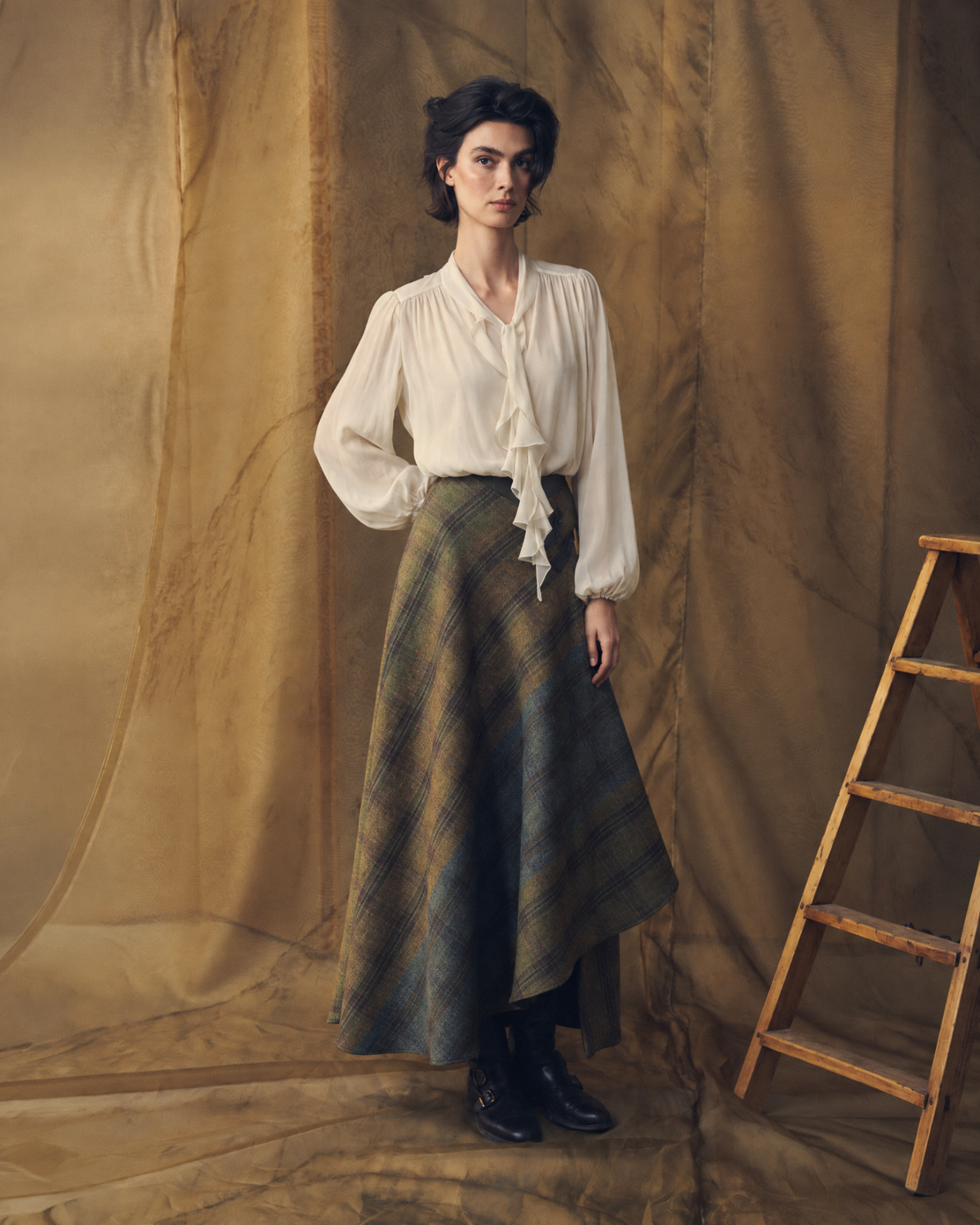Full length front view of model wearing the fluid Fine Crepe Pienza Blouse in natural silk crepe with ruffle details for women by T.ba