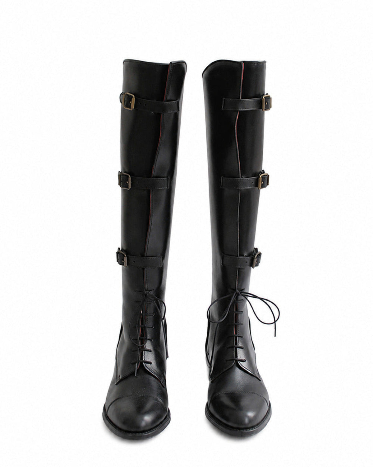 Frontal pair shot of women's black leather straps knee-high riding boots with laces and buckles T.ba