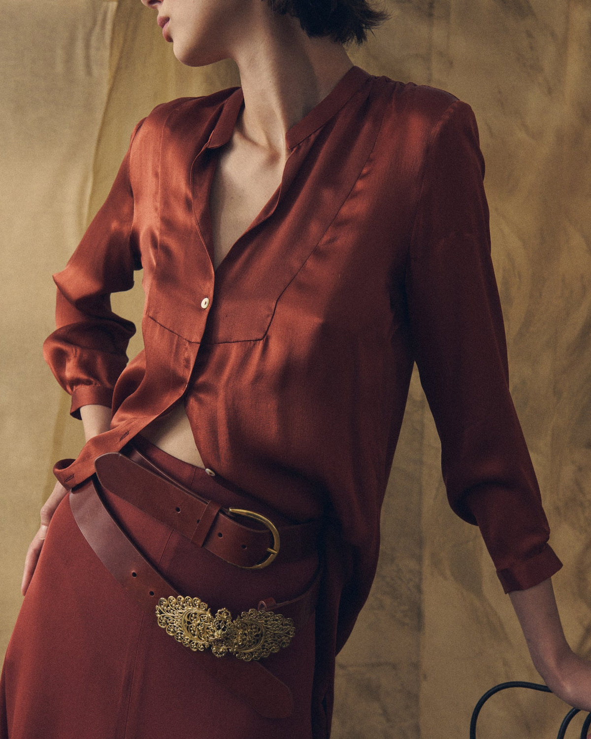 Medium shot of the Georgette Mao shirt in champagne red satin fabric featuring a mandarin collar and front buttons for women T.ba