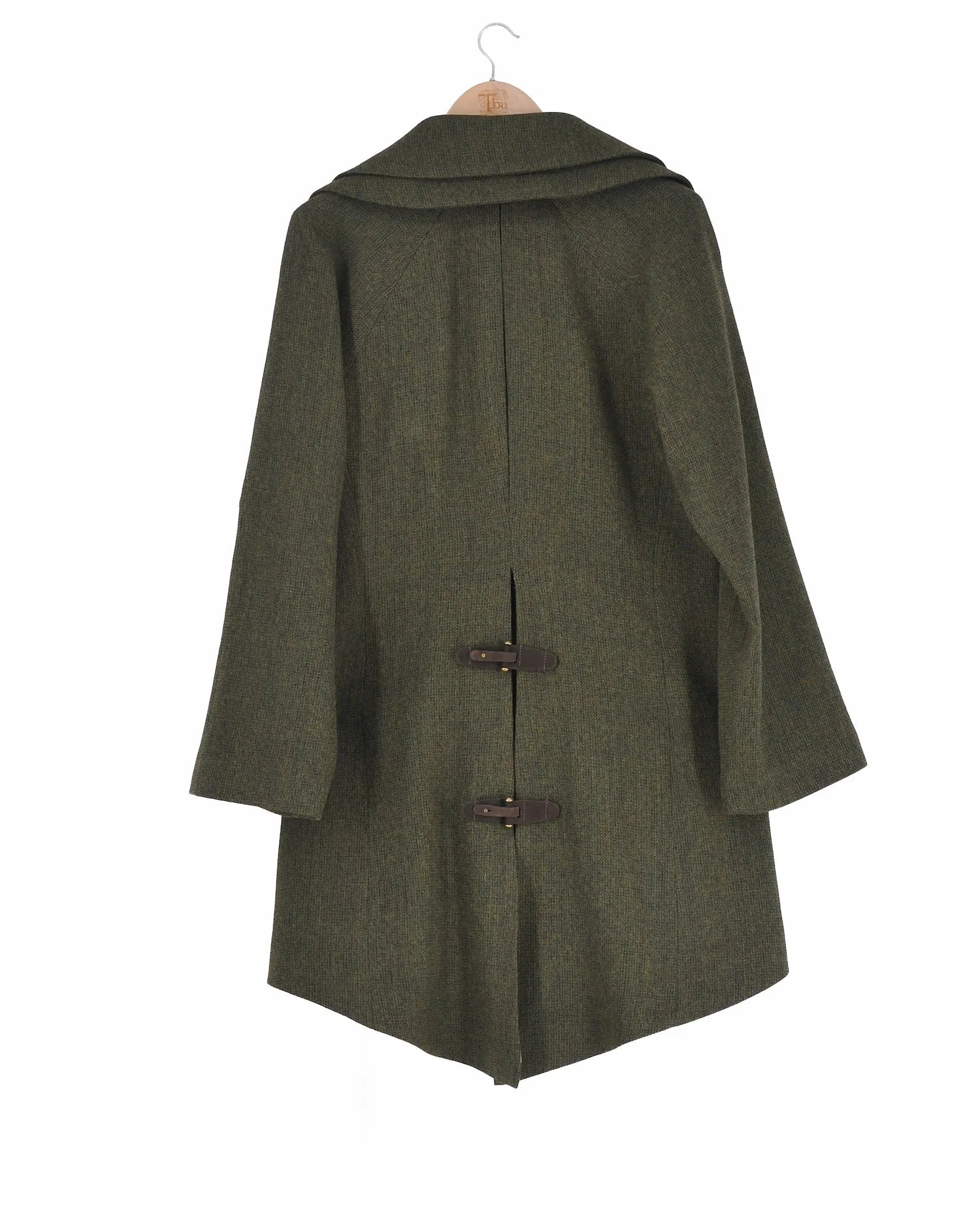 Back view of women's Jerez Biella Field Coat in hunting green tweed wool featuring broad lapels, leather buckle closures, and high-low hem by T.ba