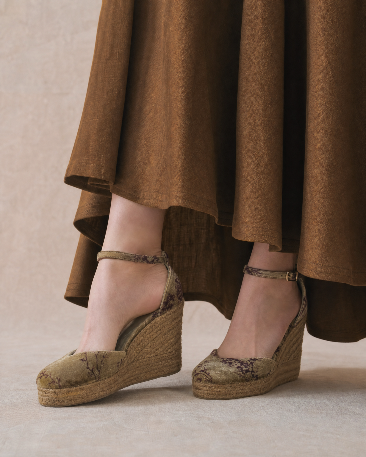 On-foot shot of Chiara wedge espadrilles in printed mocca silk velvet with ankle straps styled with brown skirt for women T.ba