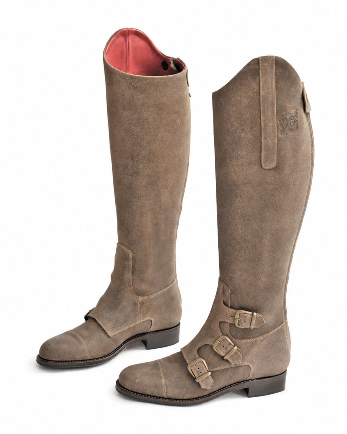 Perspective studio view of a pair of women's beige suede knee-high riding boots with side buckles T.ba