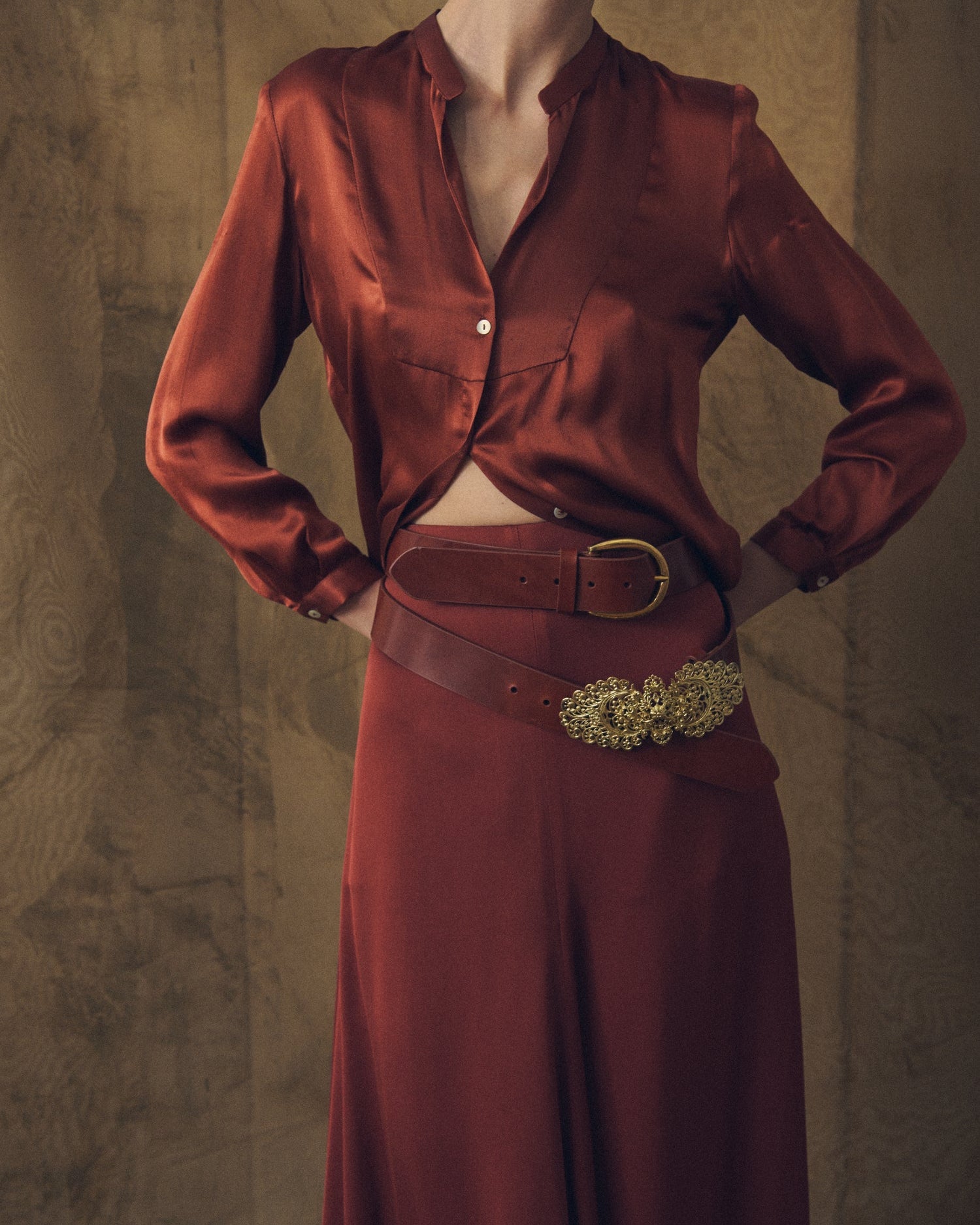 Close-up view of women's Copper Wool Sharkskin Bolero skirt showing high waistband and leather belts by T.ba