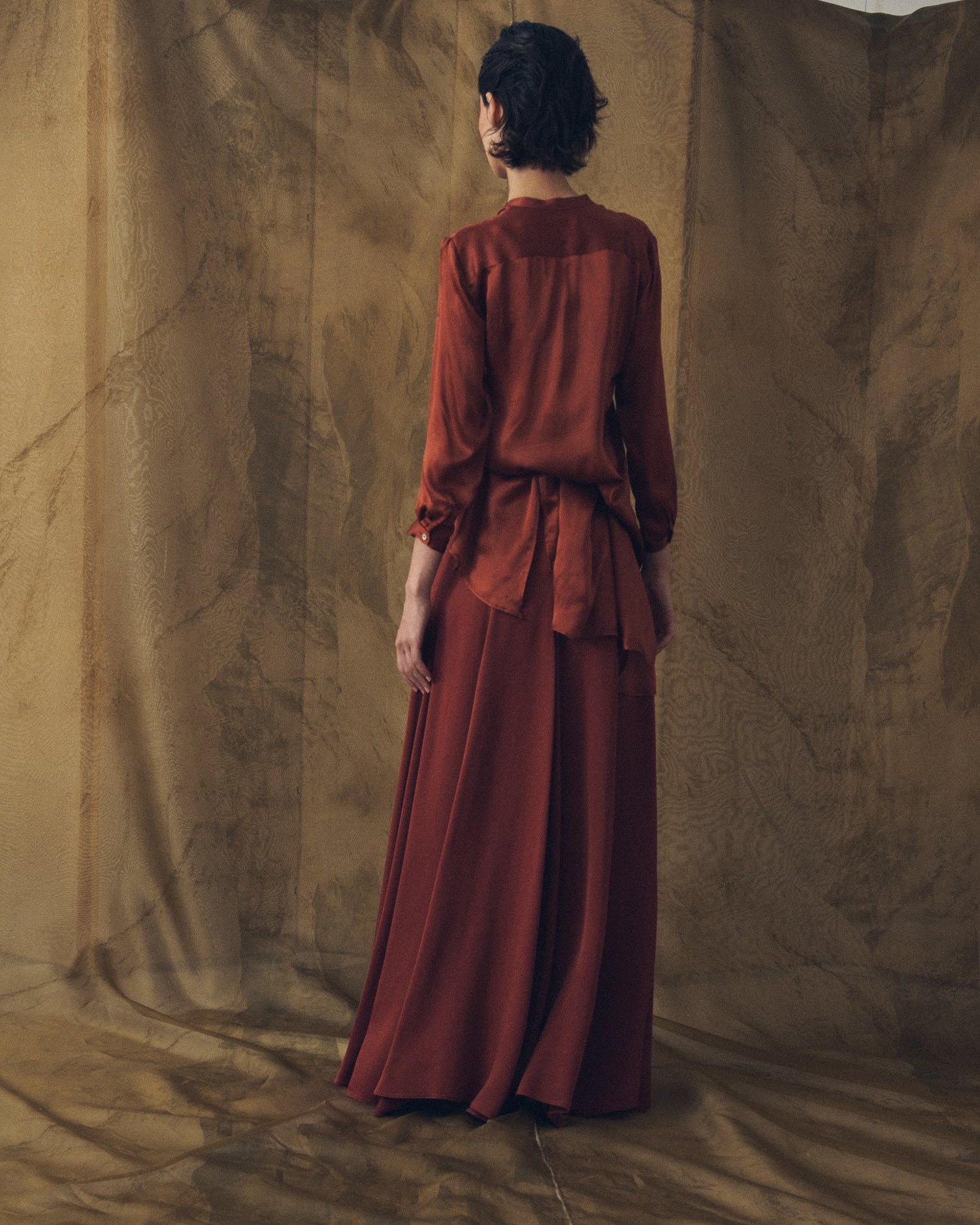 Back view of women's Copper Wool Sharkskin Bolero long flowing skirt by T.ba