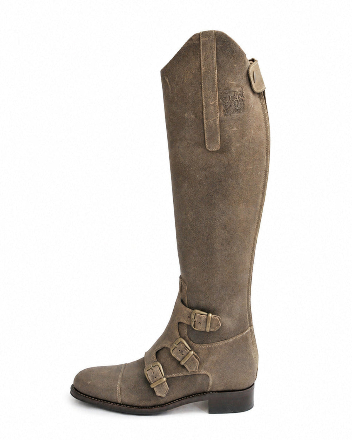 Side profile shot of women's high beige suede riding boots with triple side buckles and embossed logo detail T.ba