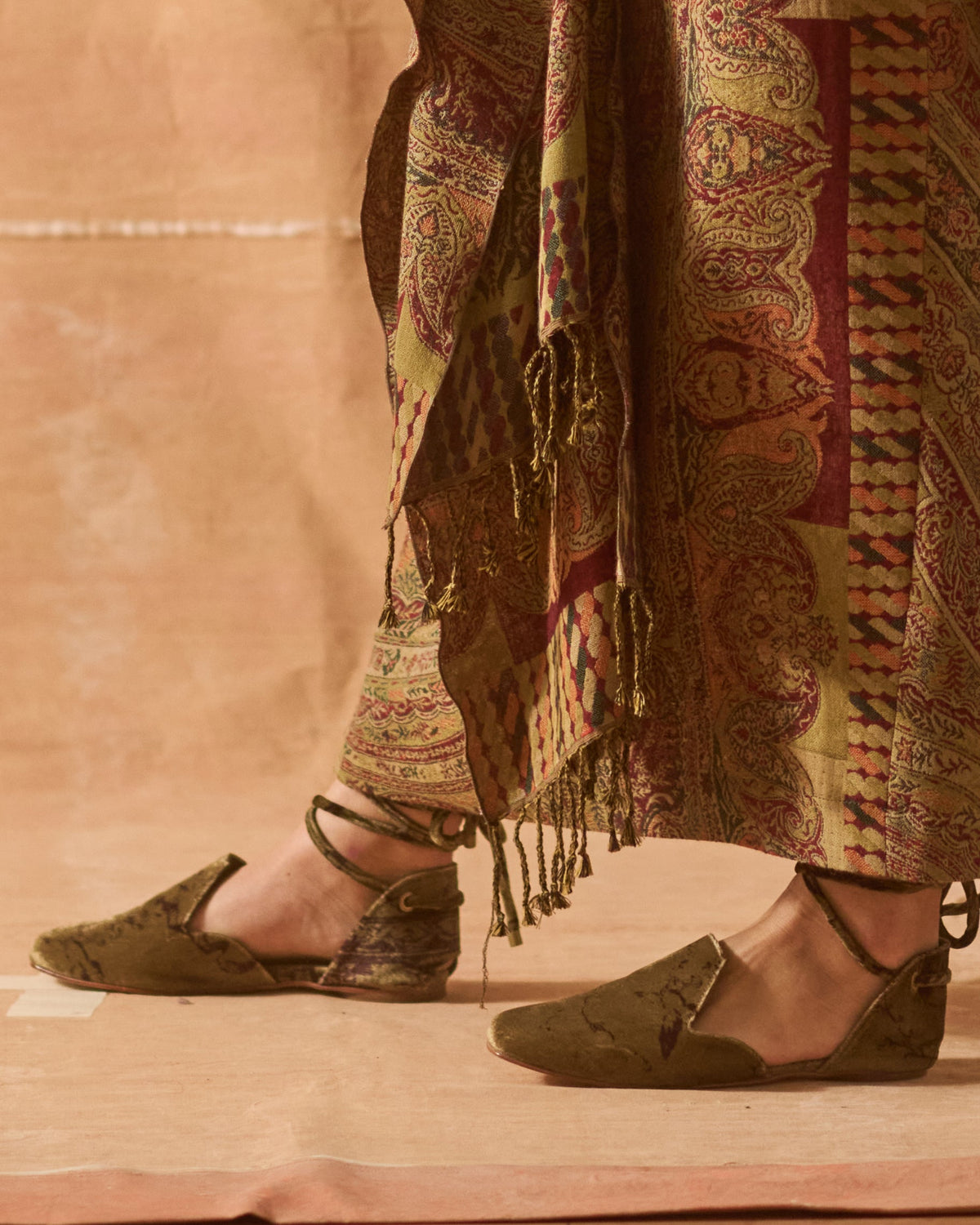 Side profile of women wearing green olive and brown patterned silk velvet Goya lace-up flat shoes T.ba