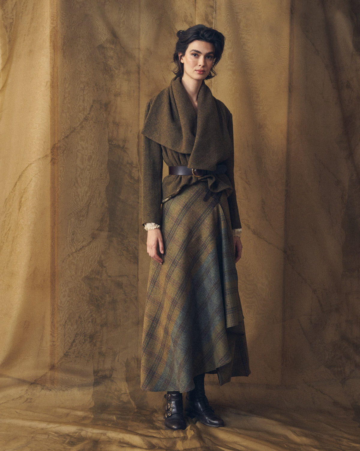 Full front length view of model wearing the Tweed Lancelot Skirt Mix plaid wool maxi skirt in earth tones for women by T.ba