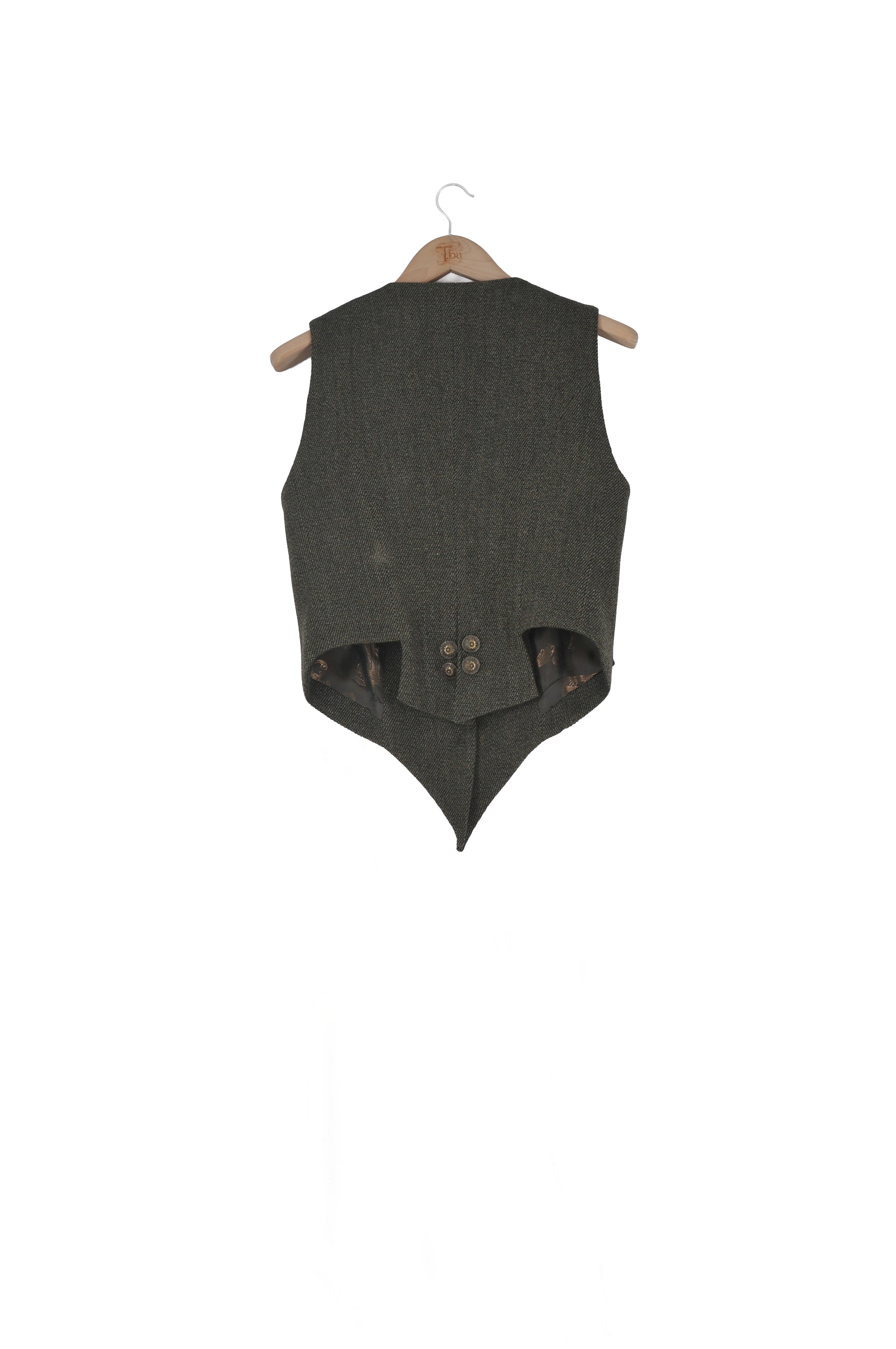 Back view of the Tweed Short Baltea Vest in slate green wool on a hanger showing the tailored waist and button detail by T.ba.