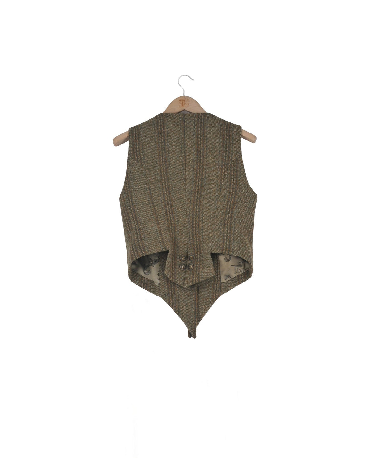 Back view of the Tweed Short Baltea Vest in green herringbone wool on a hanger showing buttoned back detail for women by T.ba.