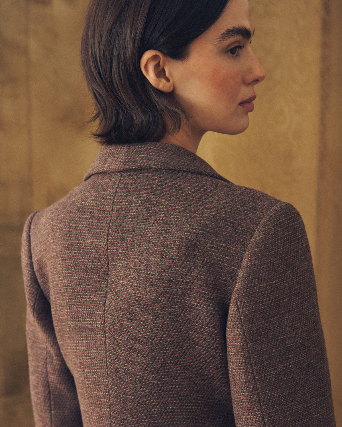 Close-up back view showing collar and shoulder texture of the Verdi Tweed Knit jacket in grape by T.ba